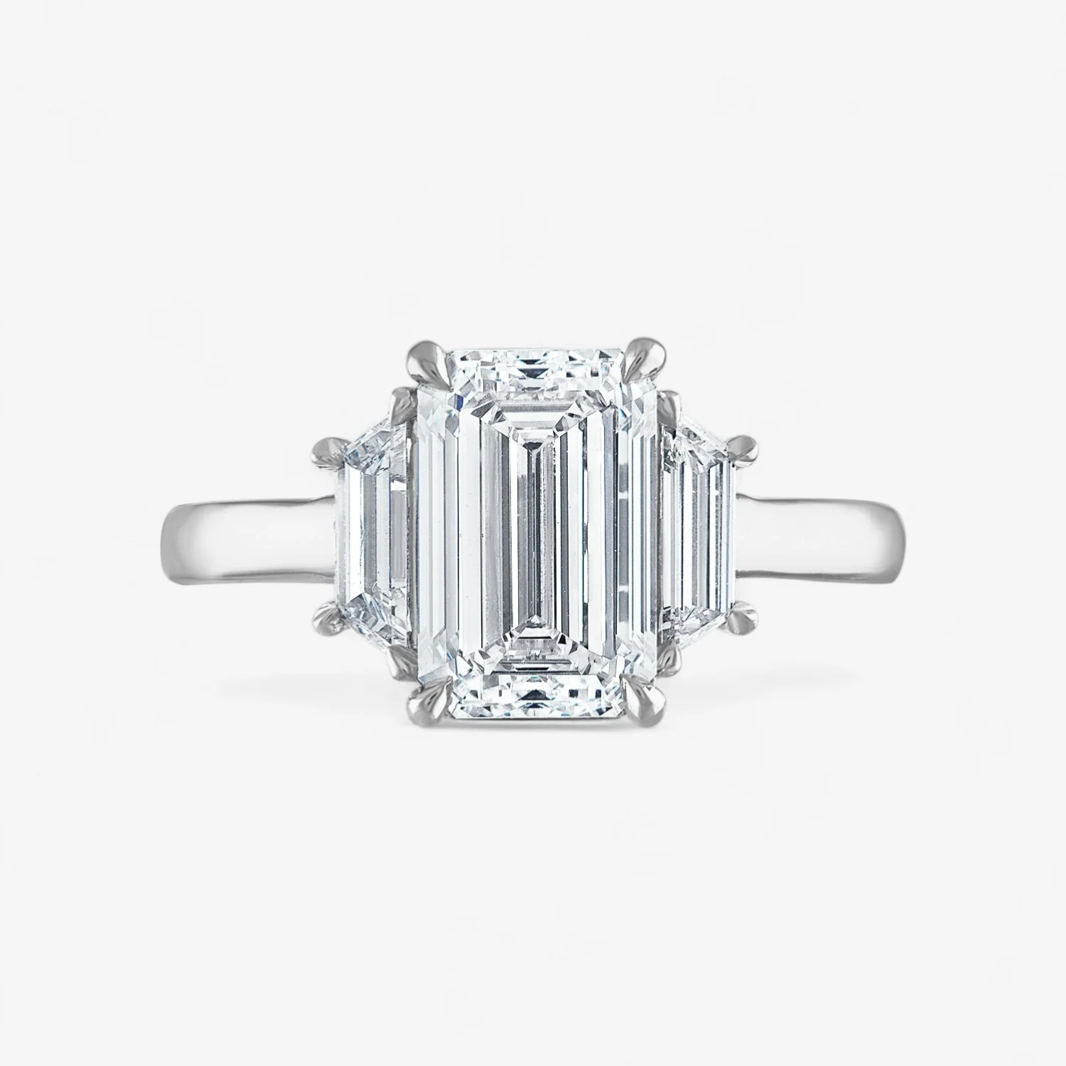 Emerald Cut Three-Stone Engagement Ring with Trapezoid Side Stones