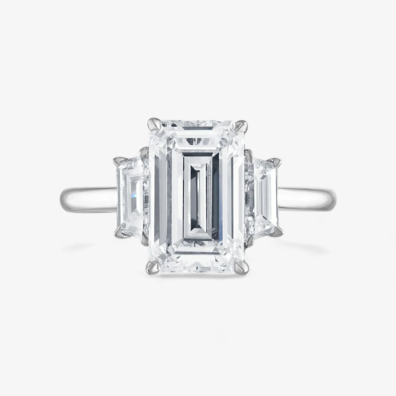 Emerald Cut Three-Stone with Trapezoid Side Stones Engagement Ring